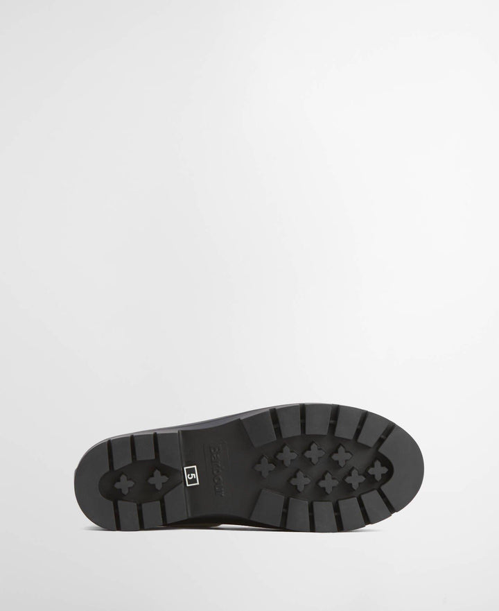 Undersiden av ankel-høye gummistøvler med kraftig profilert svart såle og Barbour-logo
